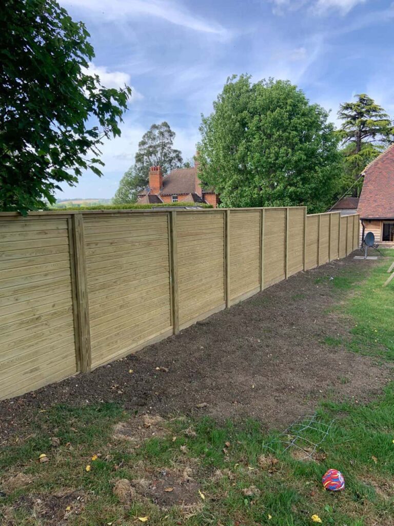 This is a photo of an acoustic fence installed by Fast Fix Fencing Godstone